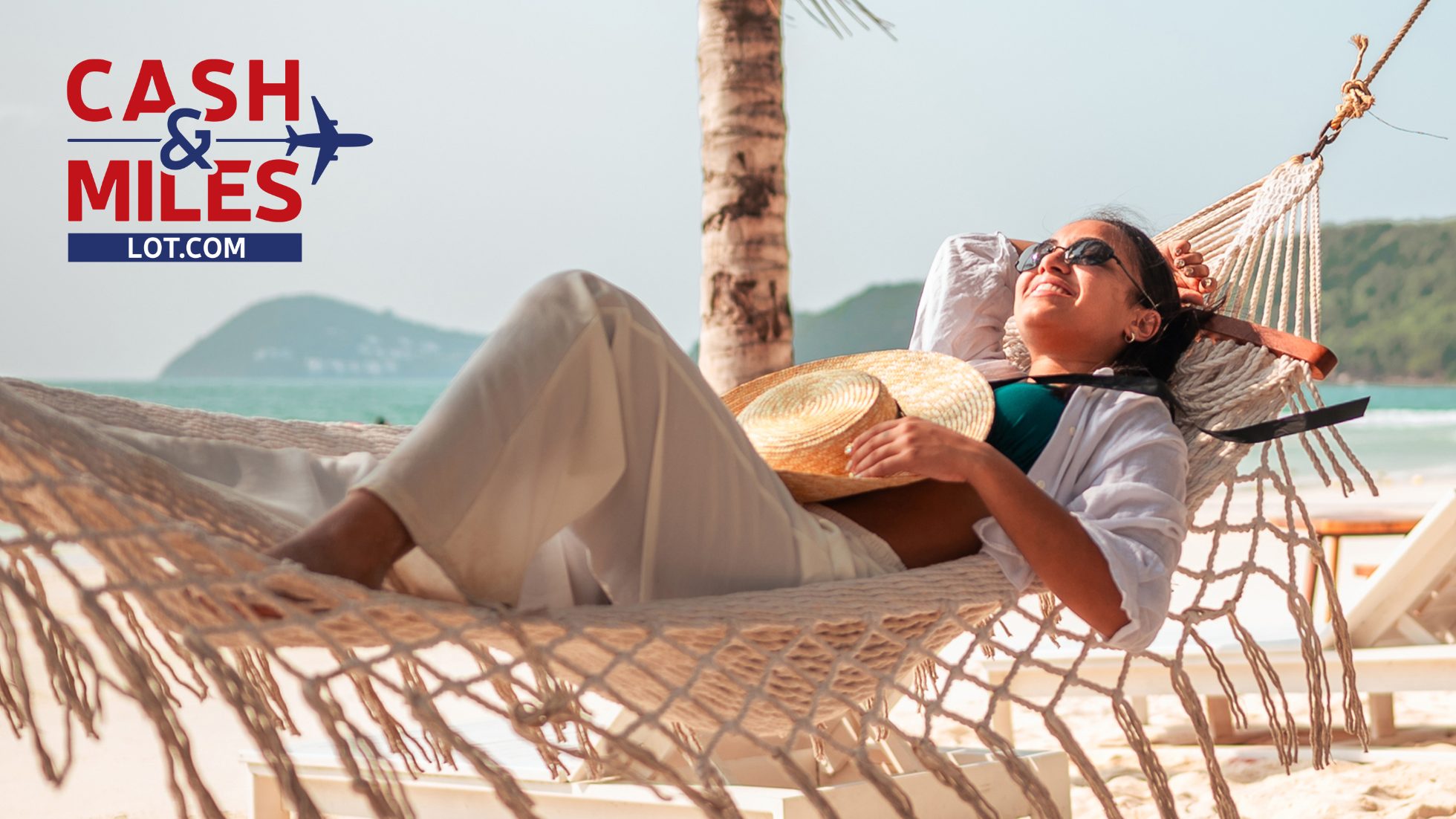 Woman on a hammock on a beach among palm trees.