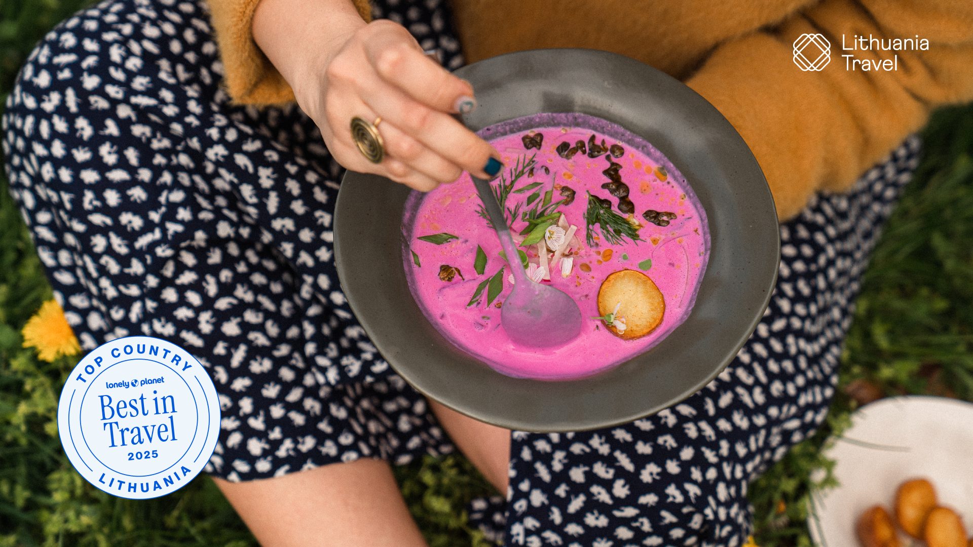 A woman eating Lithuanian cold soup outdoors