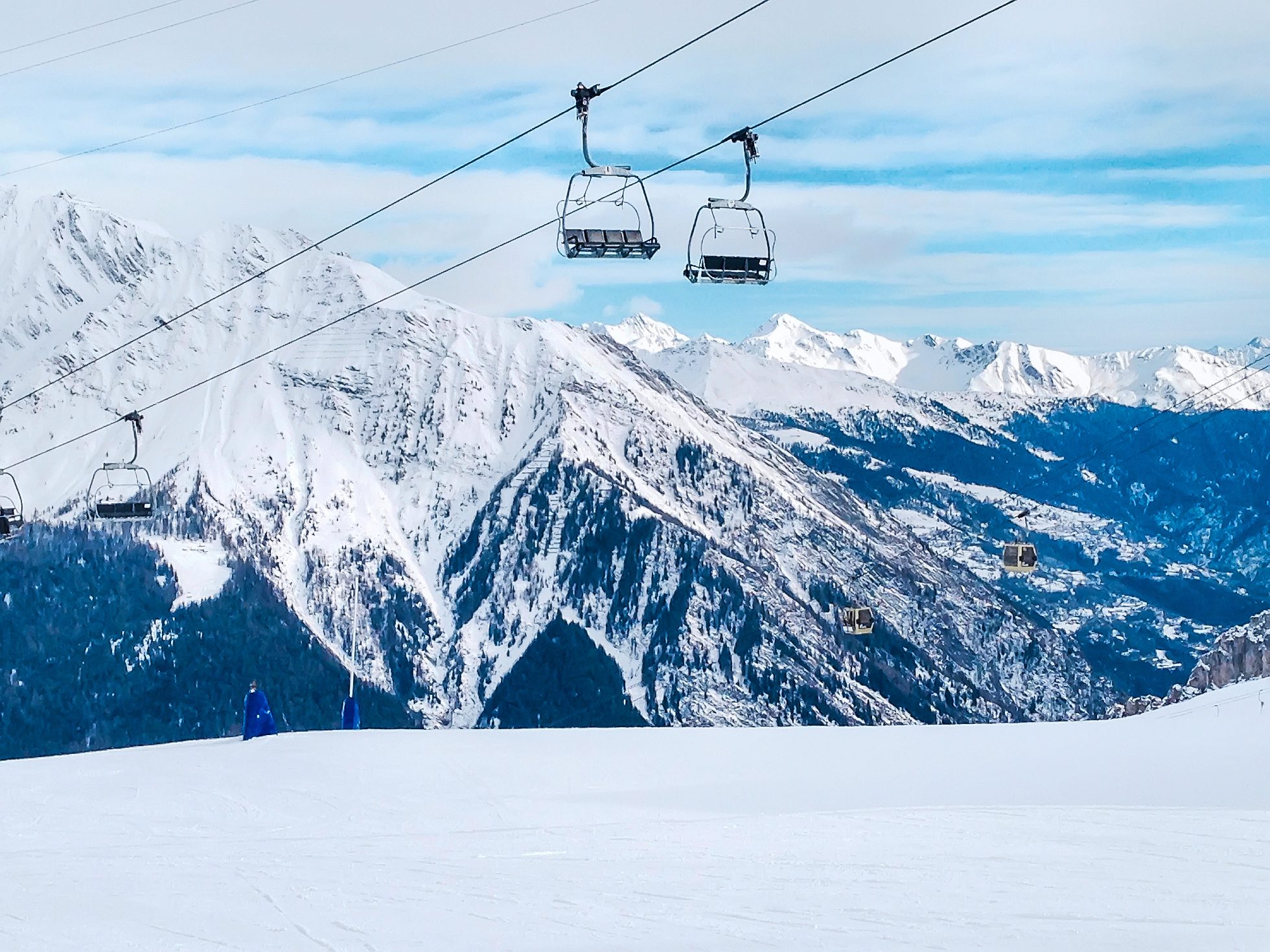 ski lift, slopes and mountains panorama of Chamonix winter ski resort, French Alps