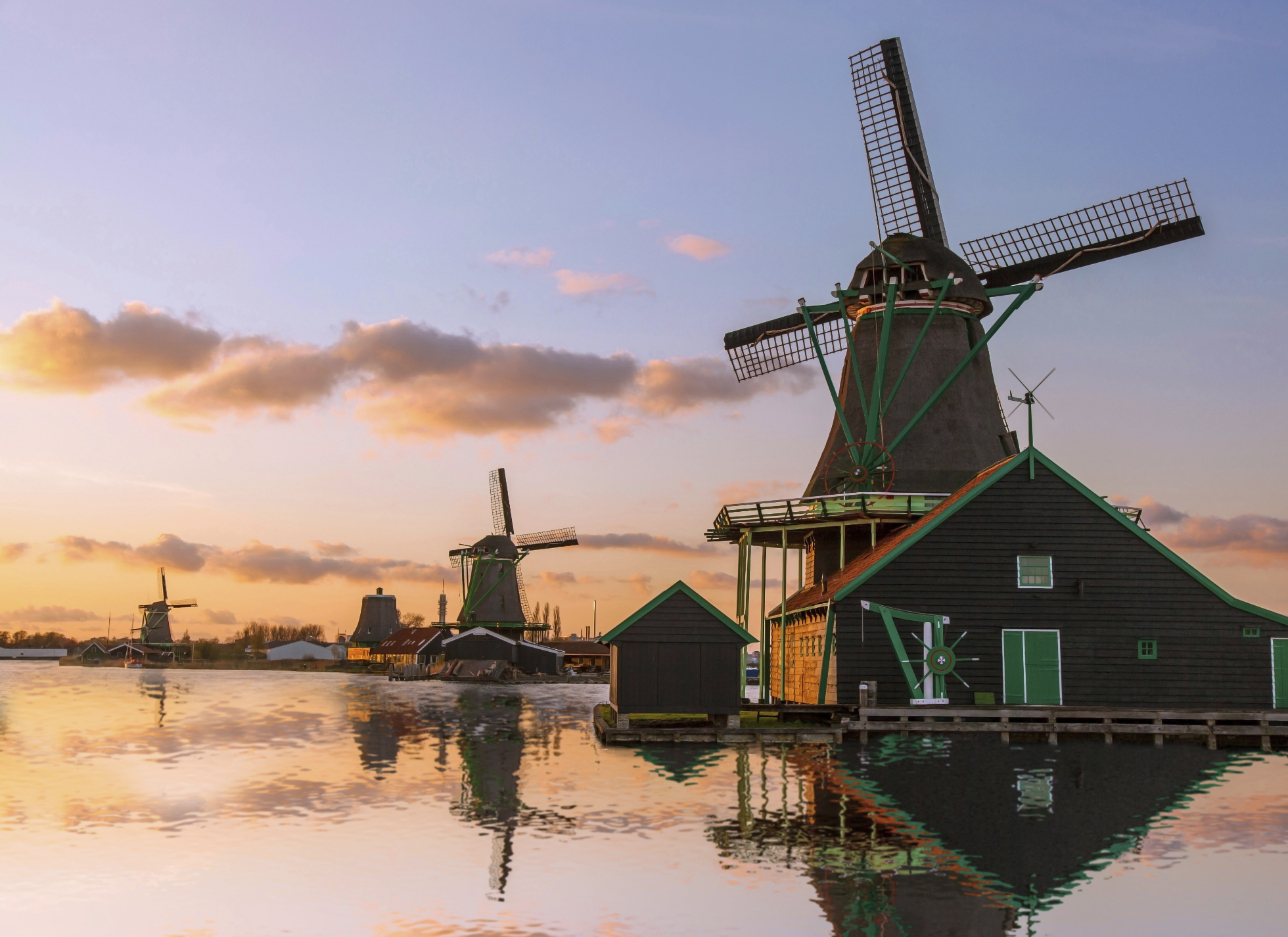 Traditional Dutch windmills in Zaanse Schans, Amsterdam area, Holland; Where to go on vacation in March?