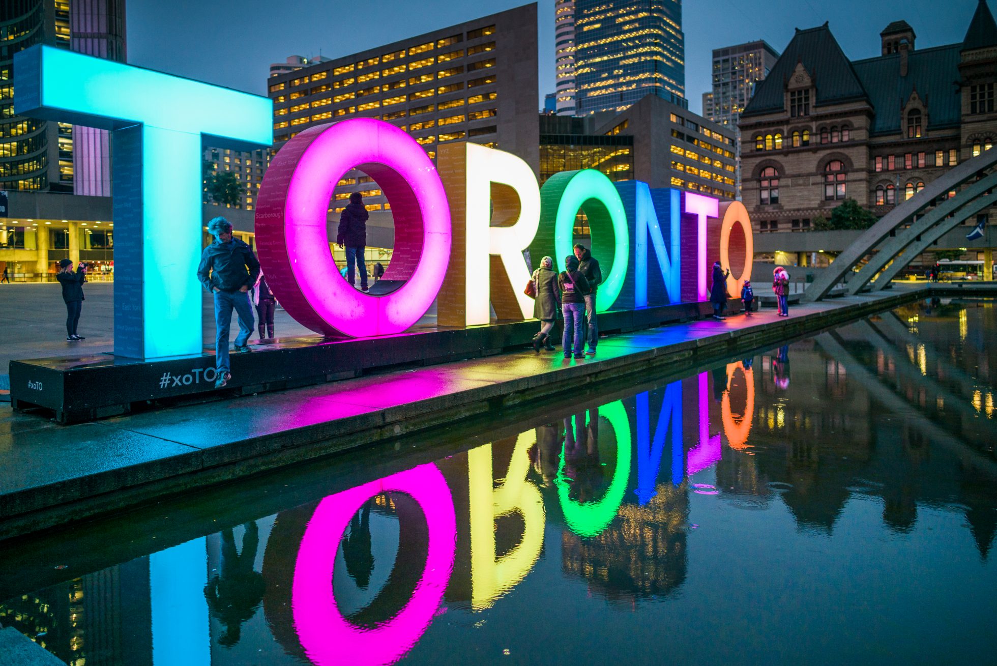 Canada, Ontario, Toronto, Toronto Sign in Nathan Phillips Square by the City Hall, dusk