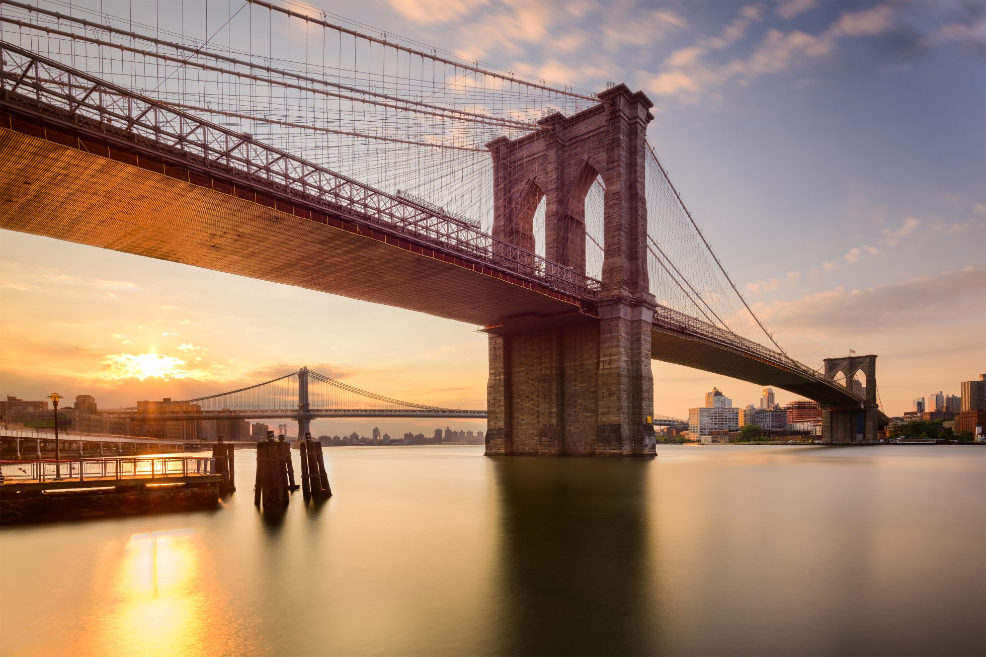 Brooklyn Bridge in New York City at sunrise.