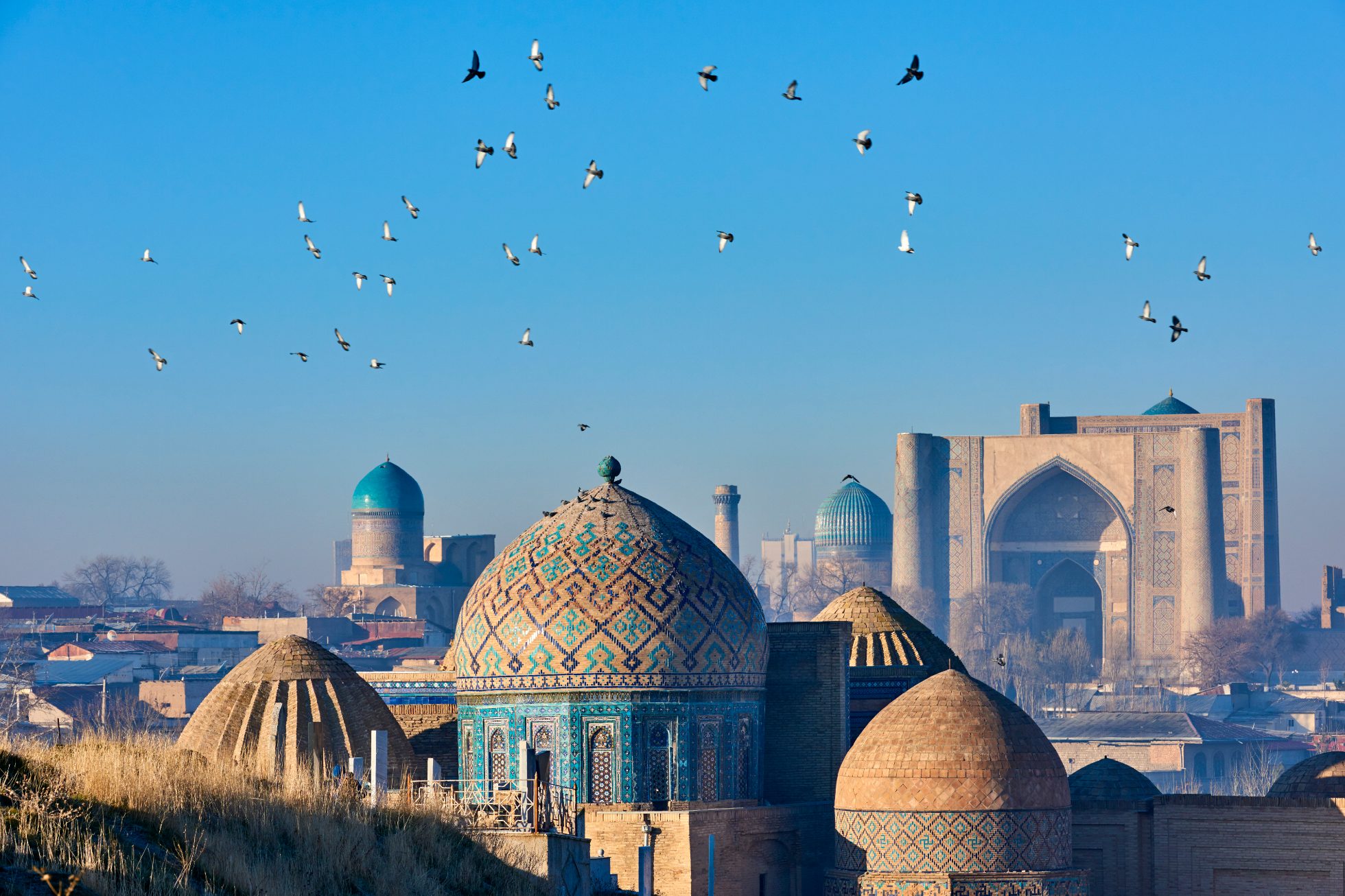 The photo shows a traditional mosque in Uzbekistan.