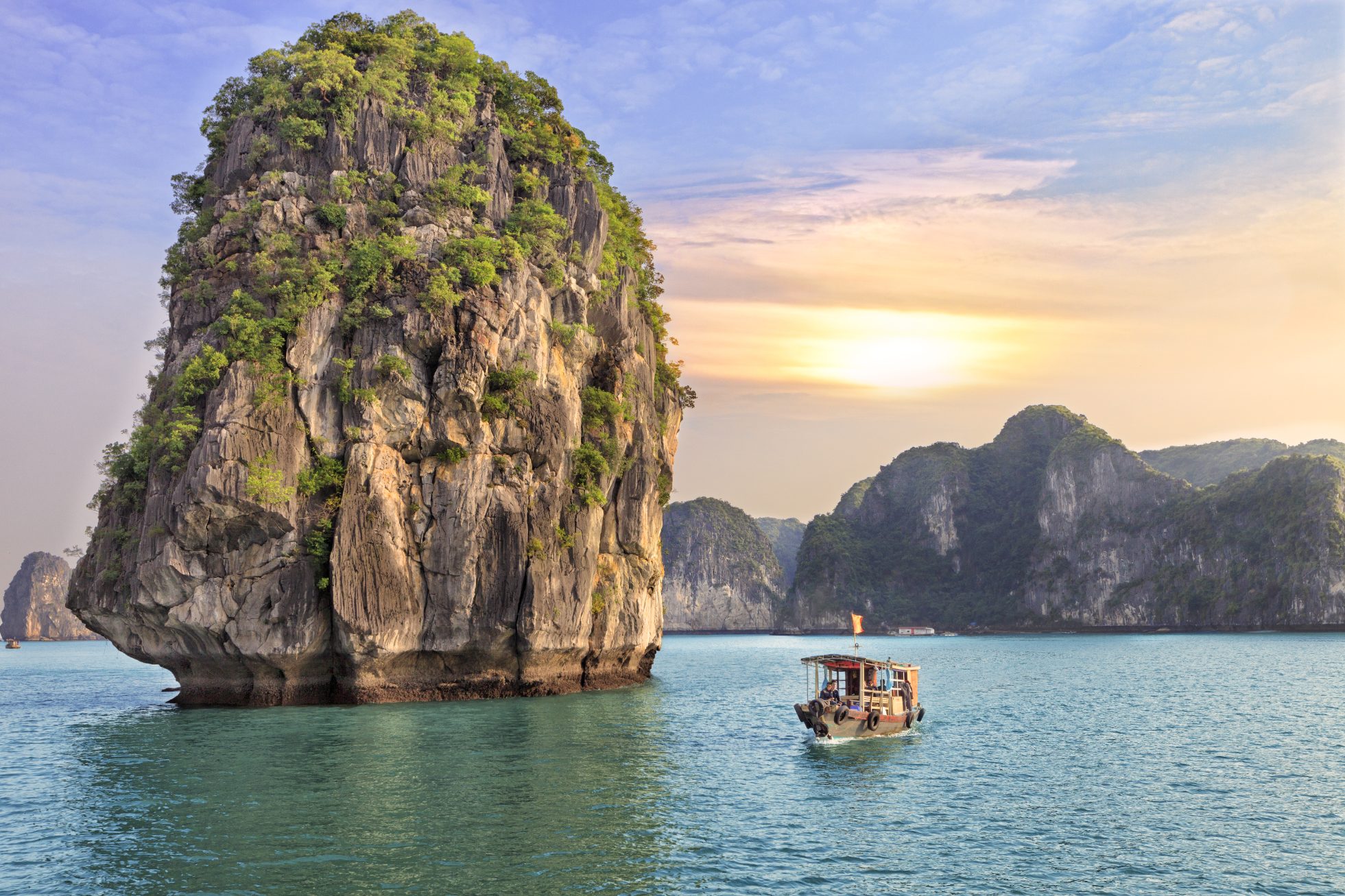 Dreamy sunset among the rocks of Halong Bay, Vietnam