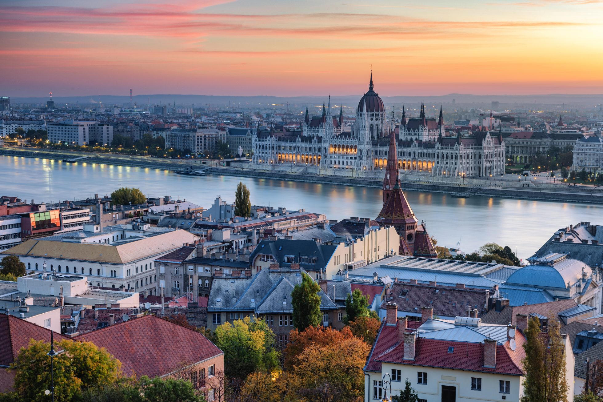 Aerial view of Budapest urban skyline with illuminated Hungarian Parliament building in the morning before sunrise