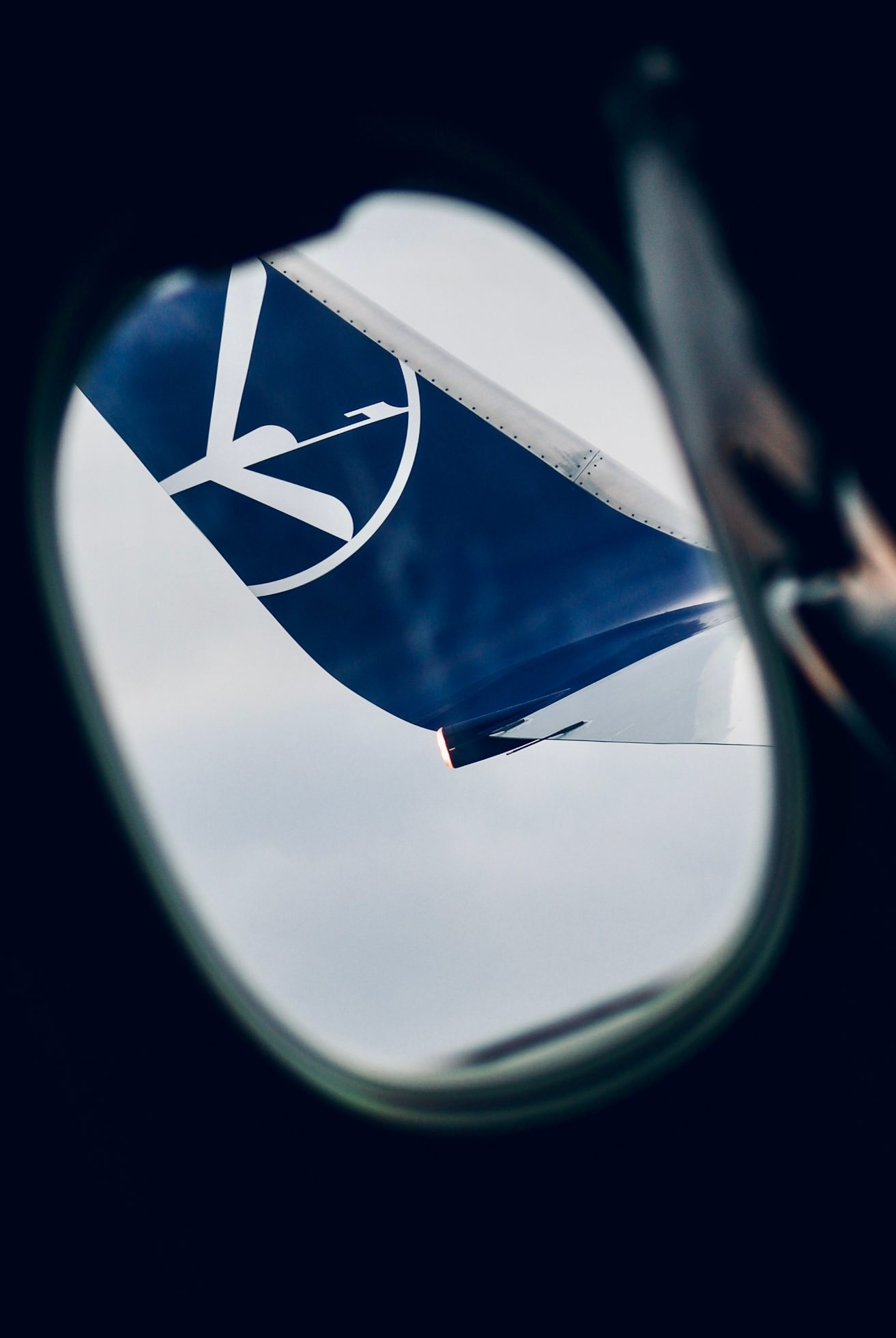 Mobile wallpaper: winglet seen through the window
