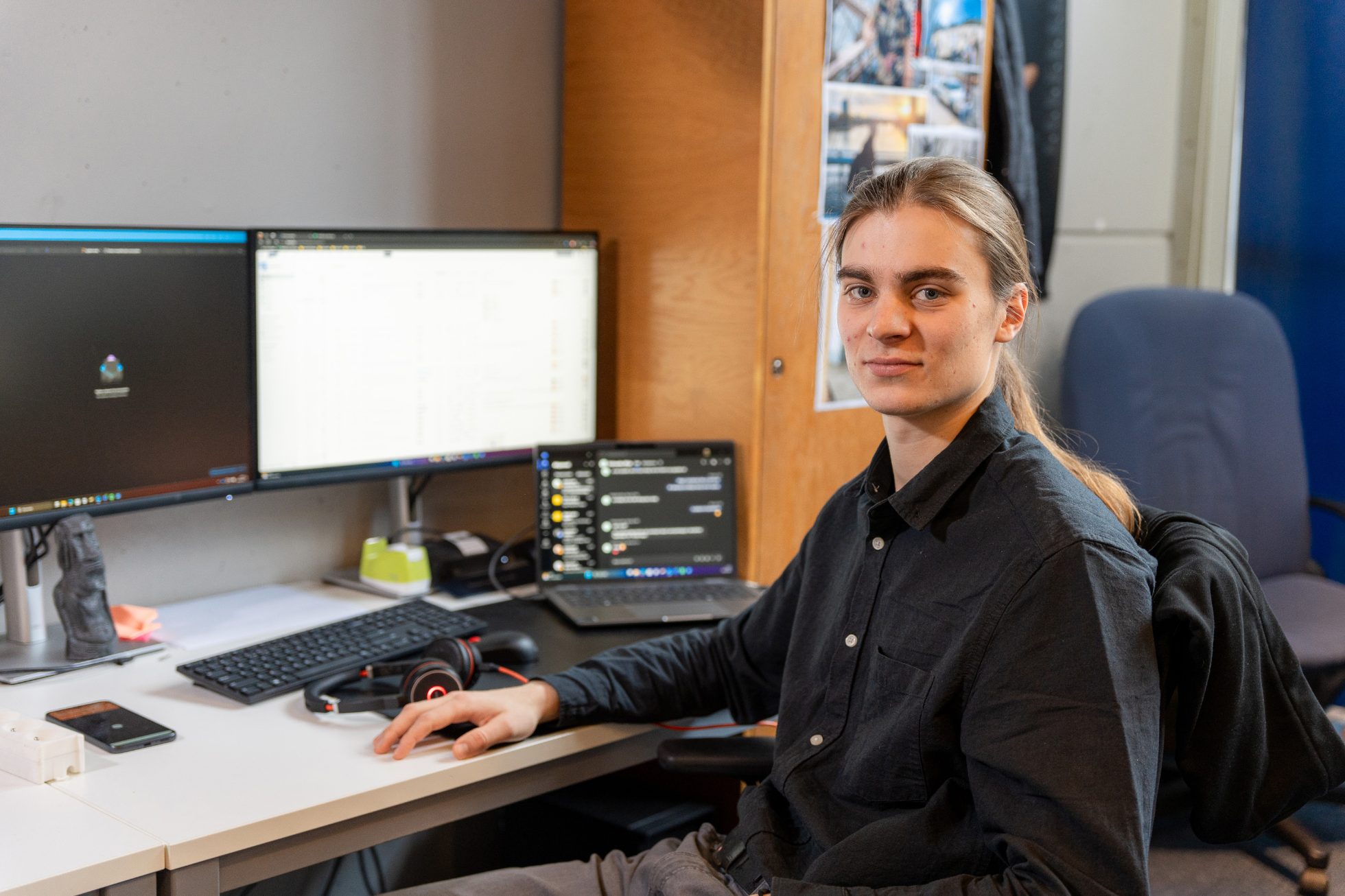 Person in office working on computer.