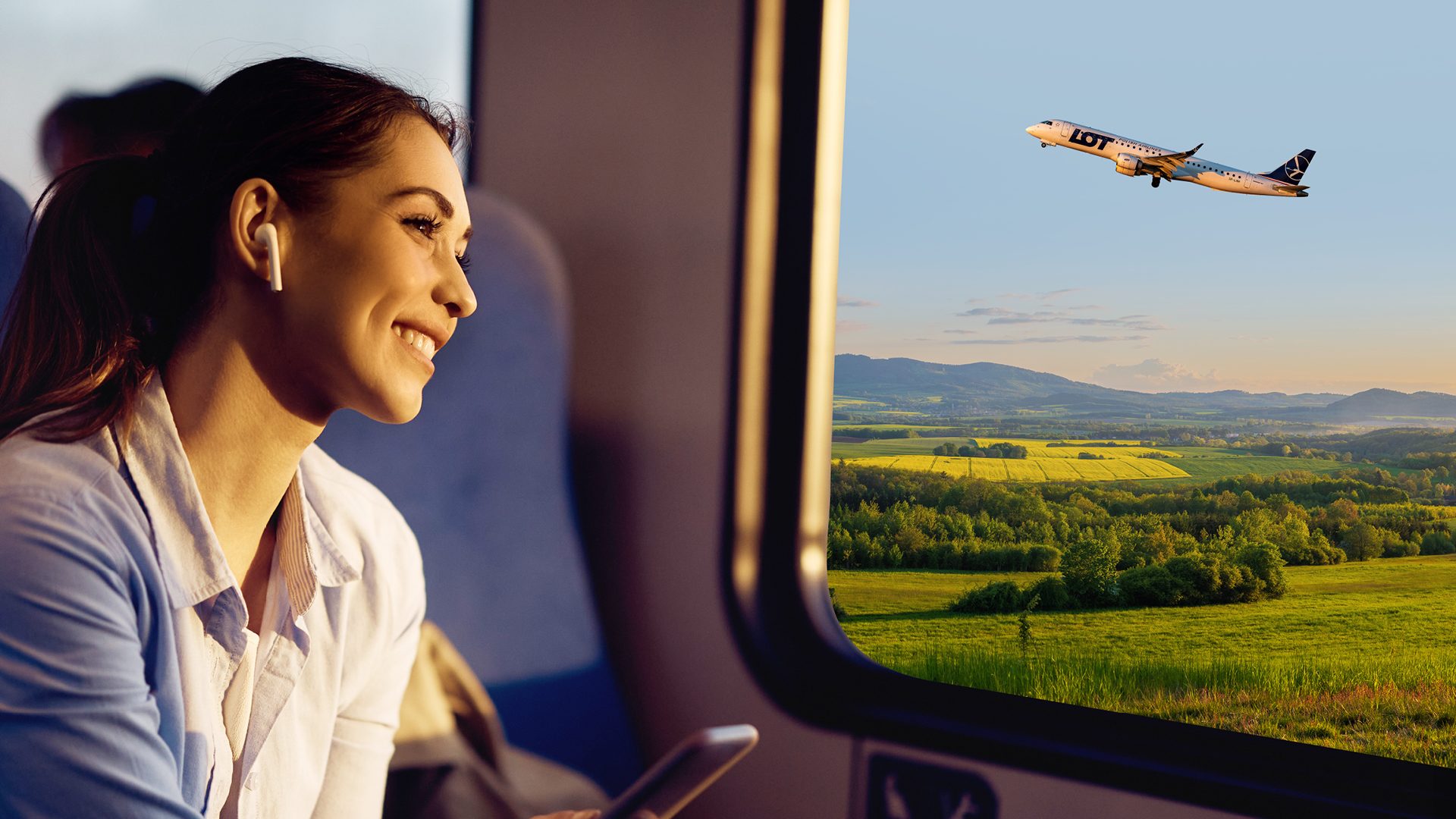 A smiling passenger on a train looks out the window at a green landscape, with a LOT Polish Airlines aircraft flying overhead.