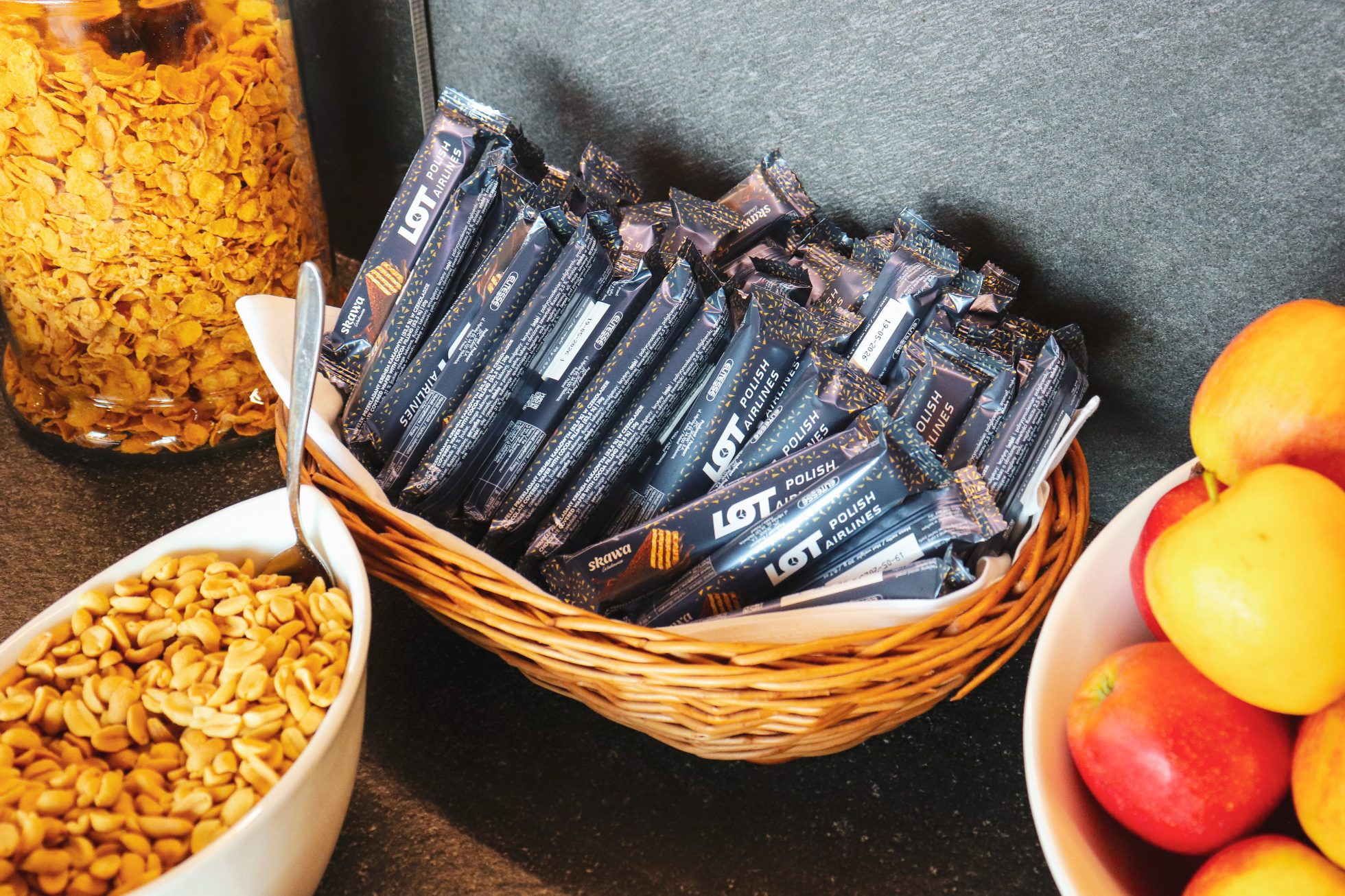Snacks in the LOT Business Lounge Mazurek – apples, peanuts, and LOT chocolate bars