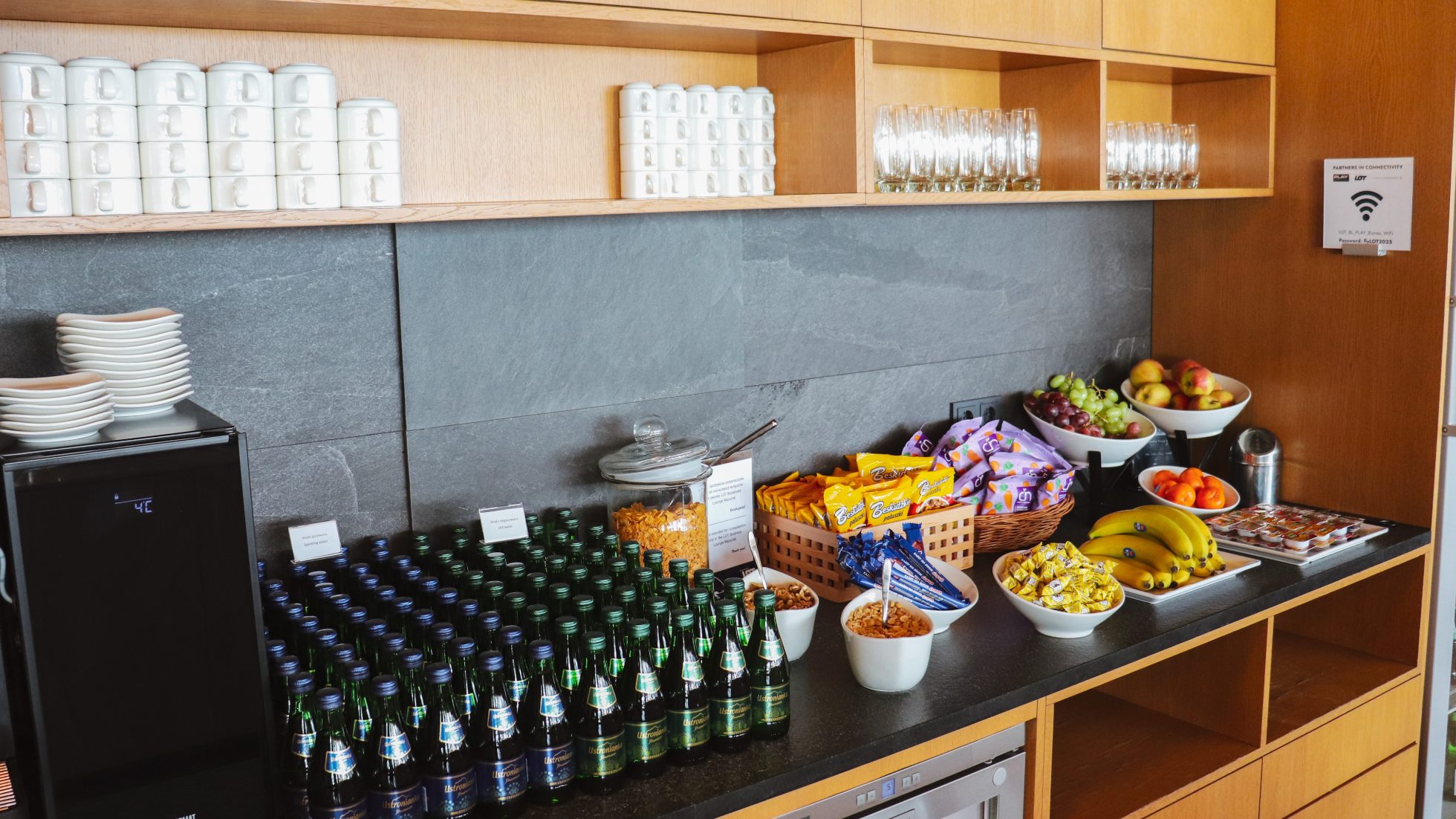 Glass bottles of water and snacks for guests of LOT Business Lounge Mazurek