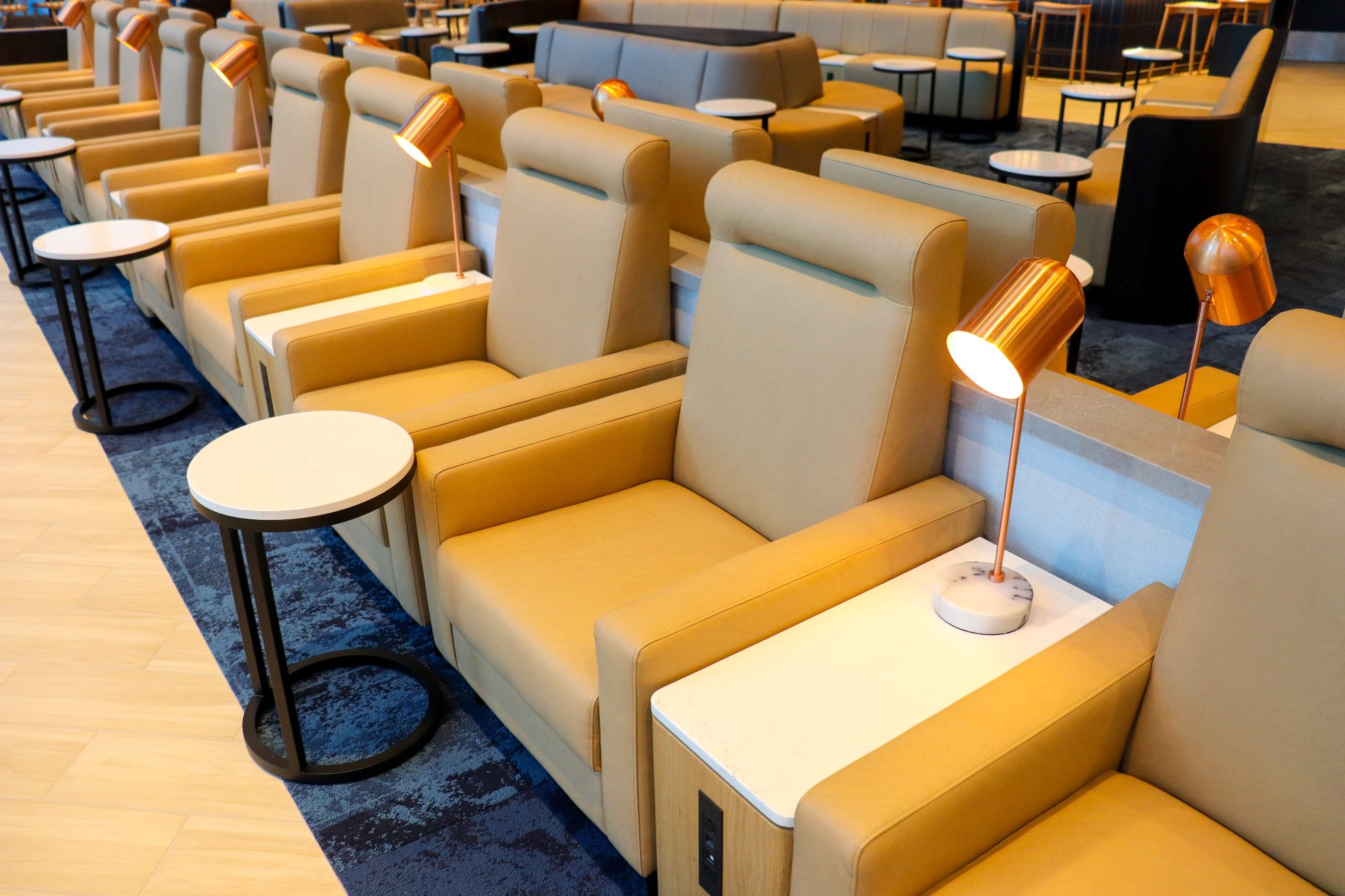 Elegant business lounge at Chicago airport. Comfortable armchairs, tables, bar, elegant lighting.