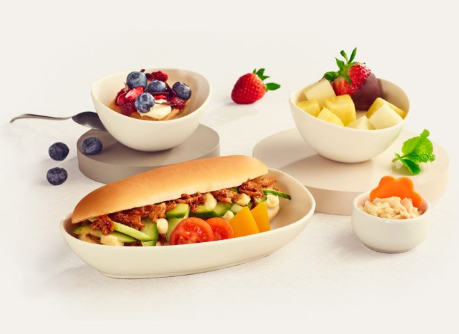Photo shows a lunchbox with food against a white background.