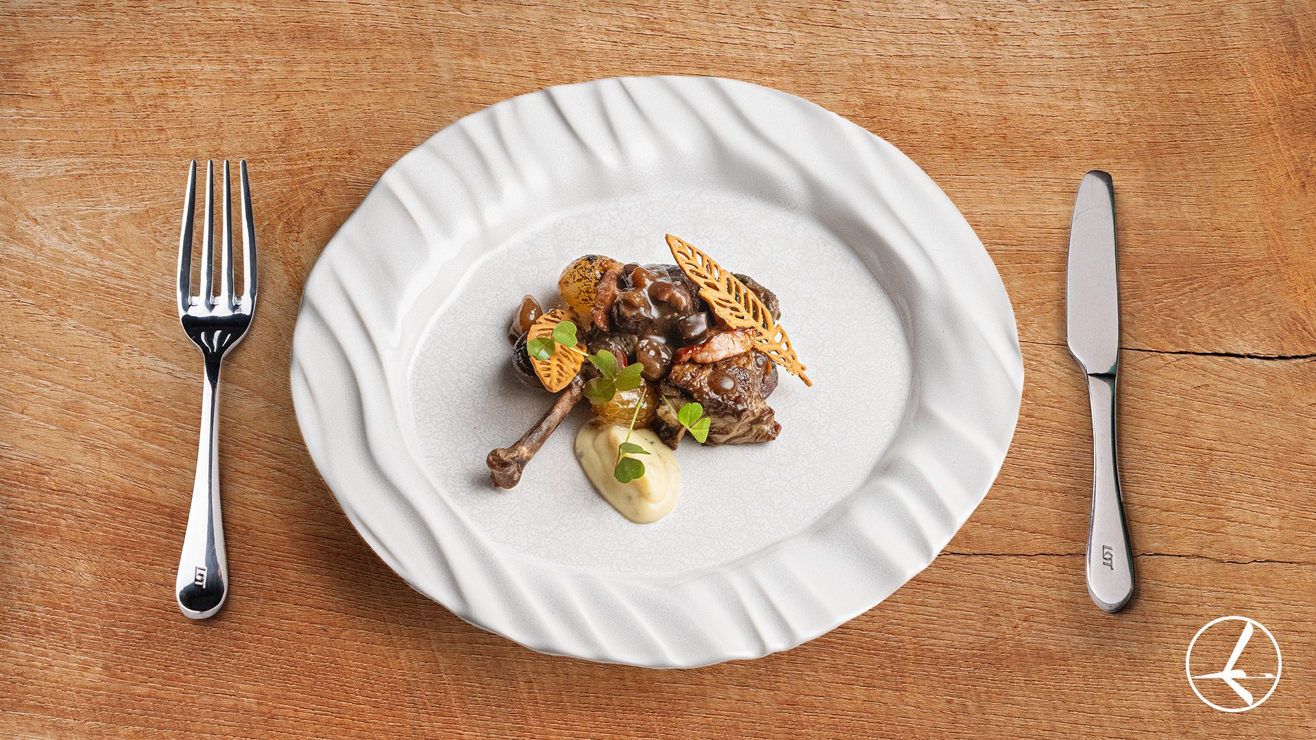 A signature interpretation of the classic Coq au Vin, featuring tender guinea fowl leg slowly braised in its own intensely flavored sauce. Served with silky celeriac purée enriched with black truffle, glazed pearl onions with pancetta, and aromatic mushrooms. A dish where rustic tradition meets the elegance of contemporary cuisine.