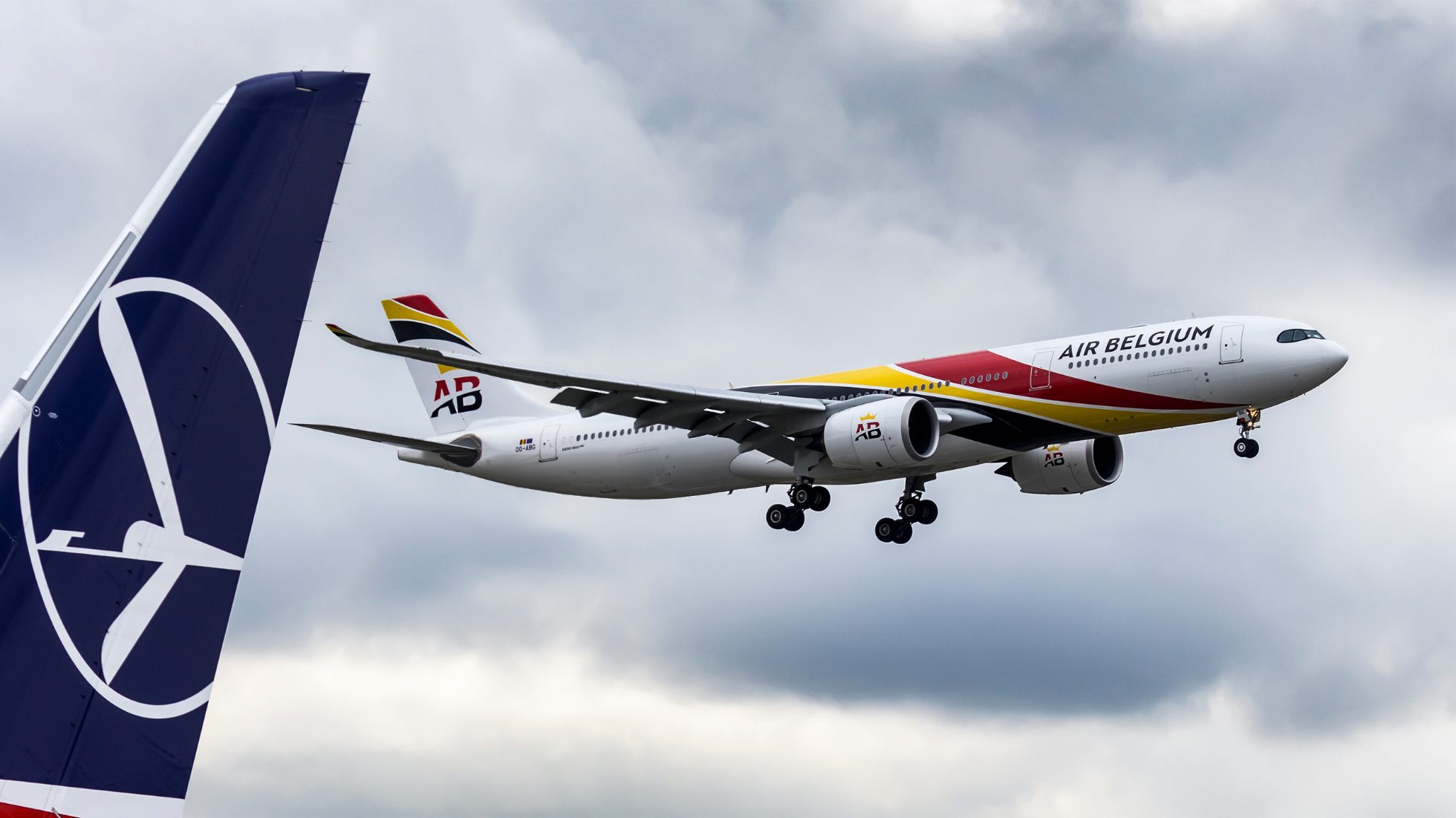 LOT Airlines A330 Air Belgium aircraft on the runway.