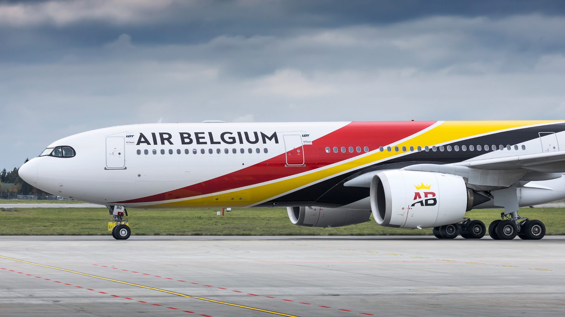 LOT Airlines A330 Air Belgium aircraft on the runway.