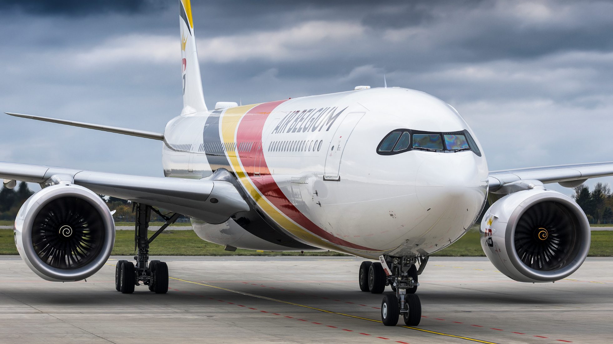 LOT Airlines A330 Air Belgium aircraft on the runway.