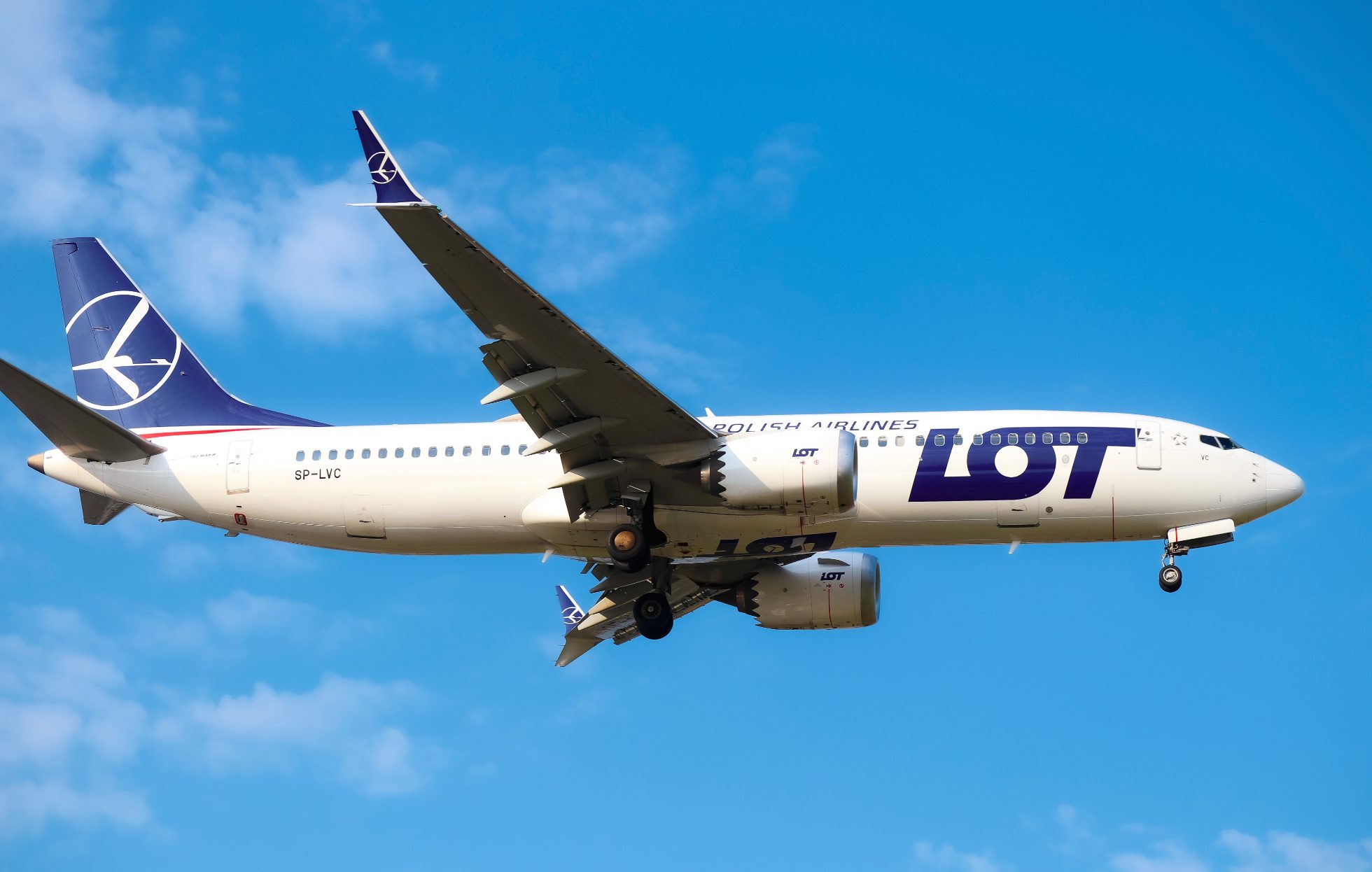 Boeing 737 MAX 8 approaching WAW airport on a sunny day