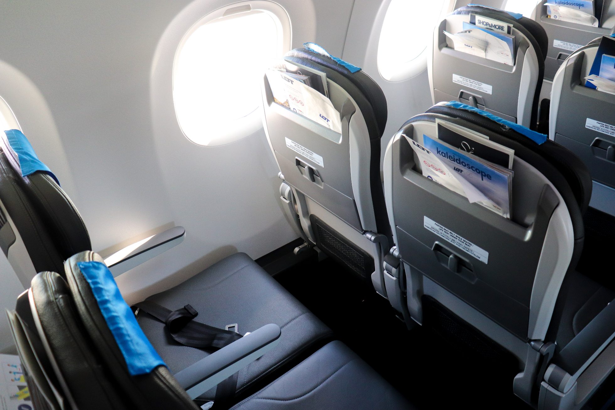 LOT Airlines economy class aircraft. Comfortable seats, carry-on baggage space, and modern equipment.