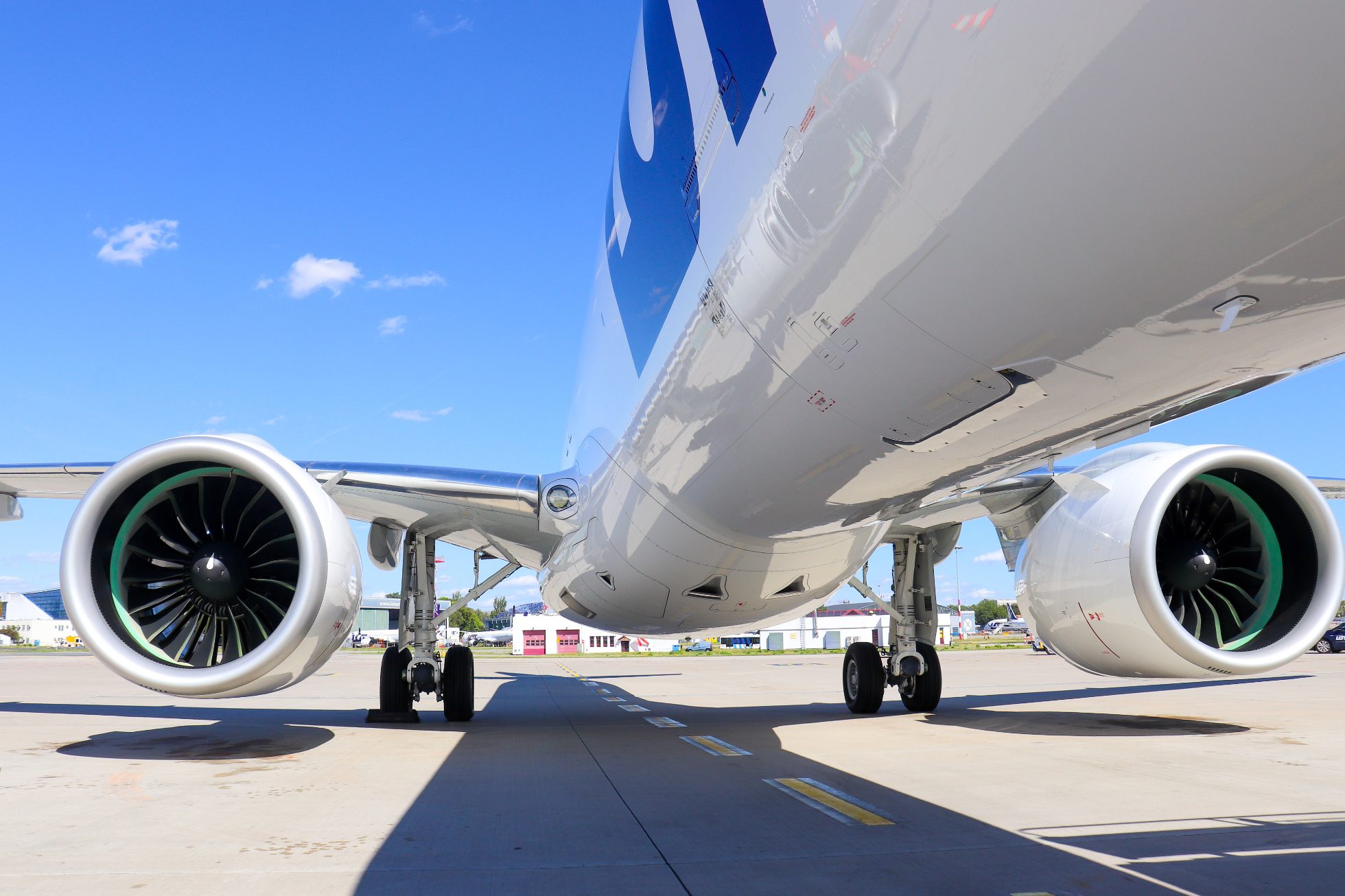 Embraer E2 aircraft engines against the sky.