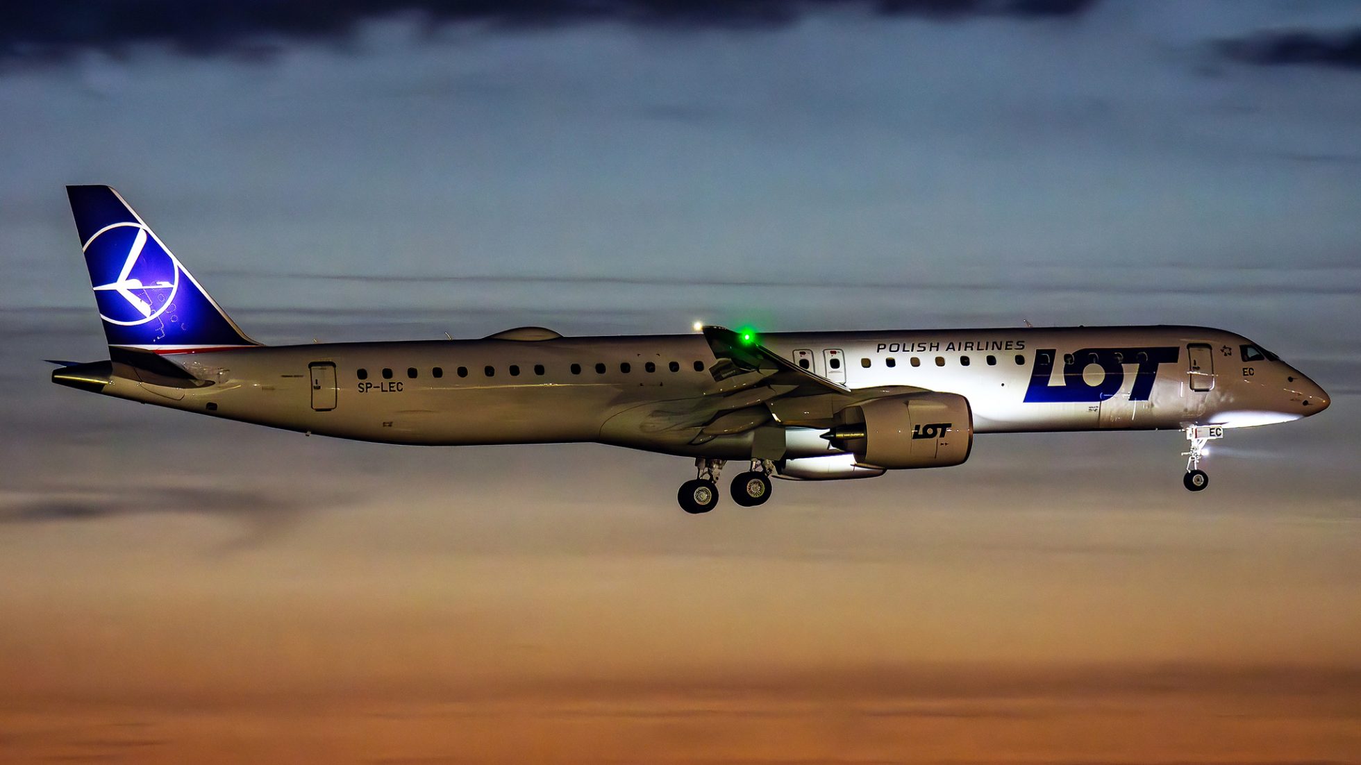 Embraer E2 aircraft on runway.