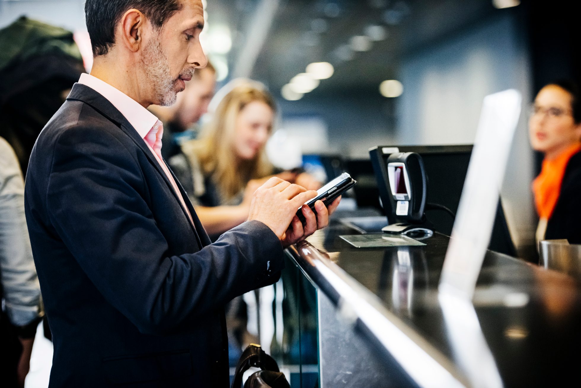 Businessman checking-In using mobile boarding pass