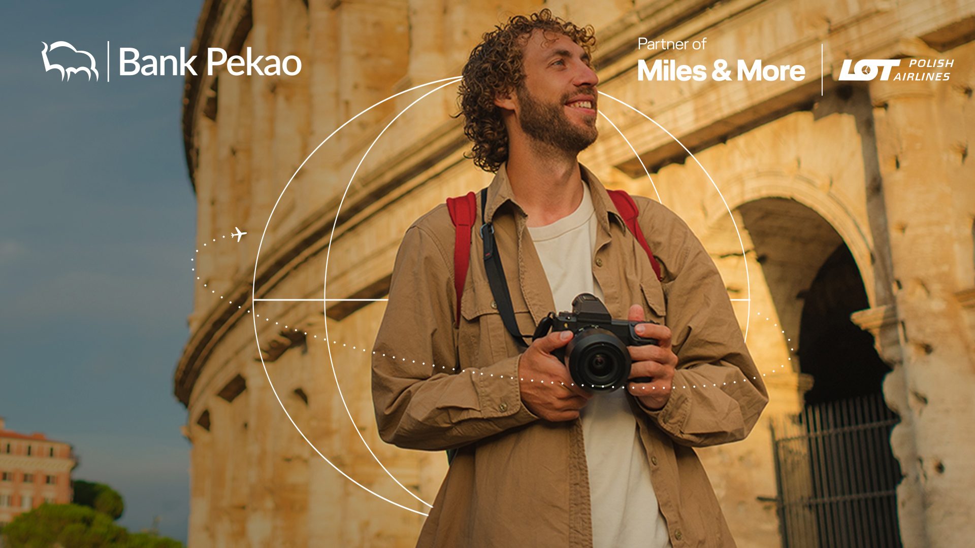 A man by the Colosseum in Rome with a camera.