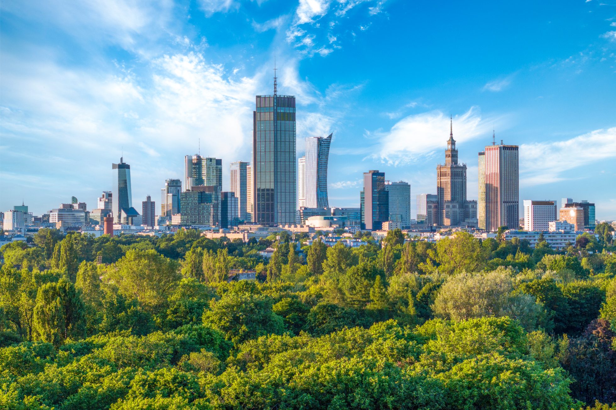 Aerial, drone panorama of Warsaw city during sunset. View from Pole Mokotowskie Park