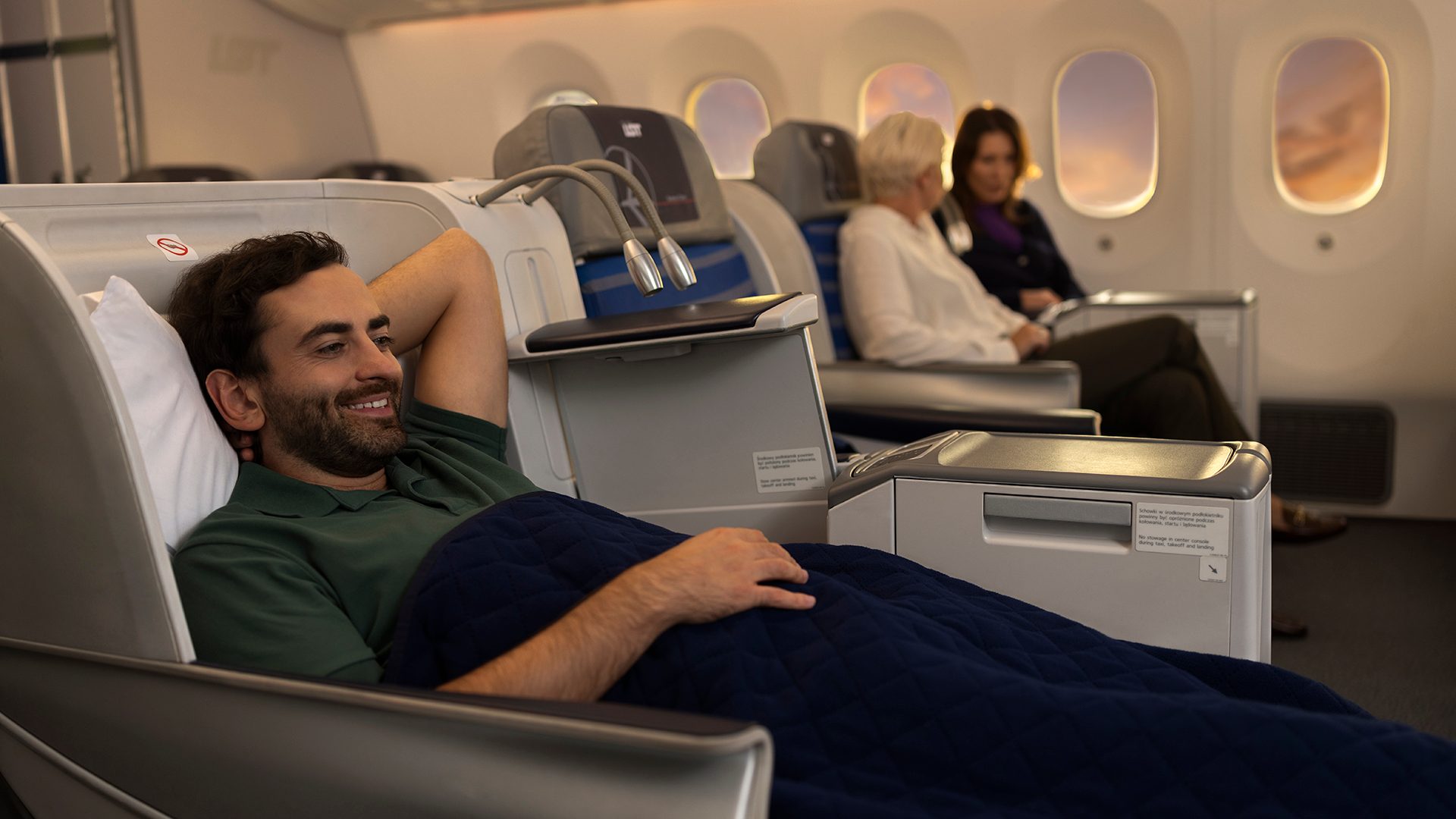 Passenger lying on seat aboard Dreamliner