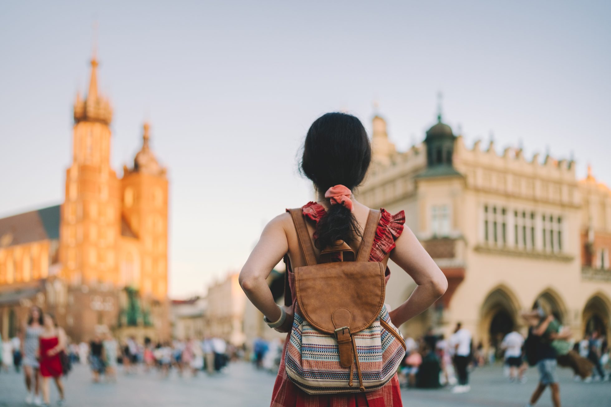 The young girl visits the market in Krakow on a sunny day