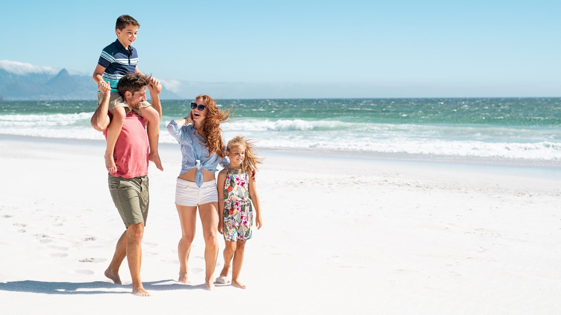 A cheerful family with children on the beach
