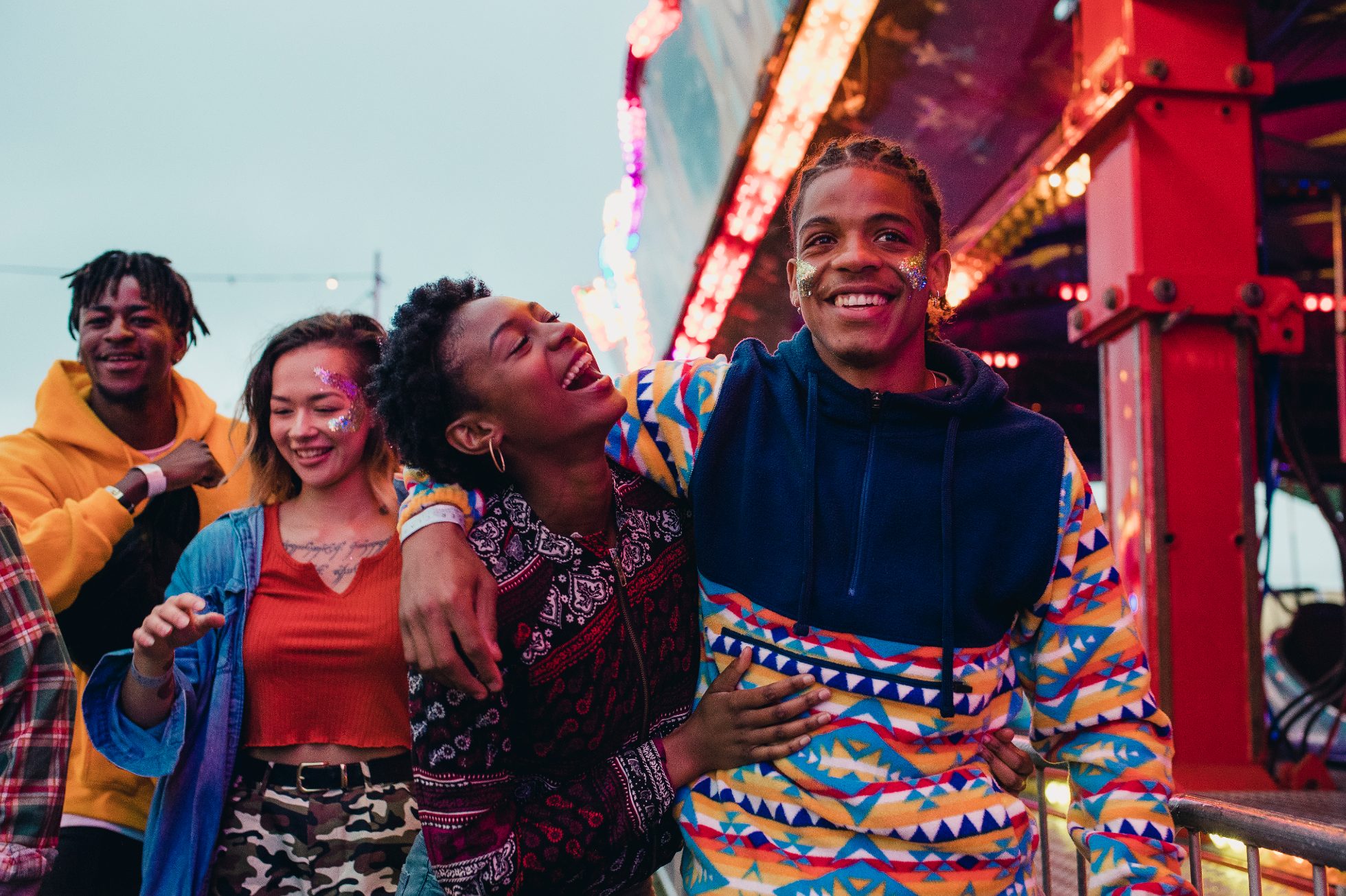 A happy group of friends at an amusement park