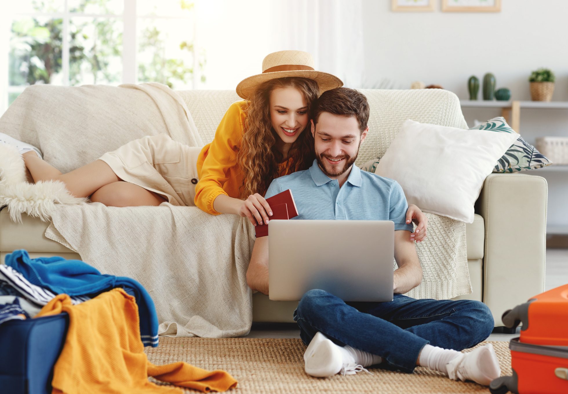 A young couple browses promotional offers for cheap flights by plane.